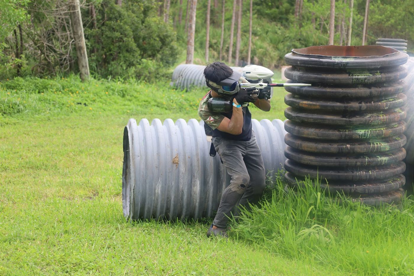 Player firing from behind a stack of tubes