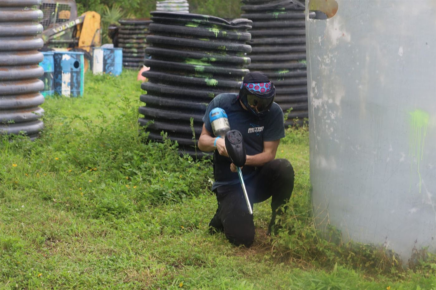 Player kneeling behind a bunker, aiming